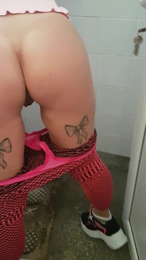 Hottie gets naughty and fingering herself while pissing in public toilet