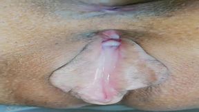 J- A Japanese cutie shows off her gripping little hole in a doggy style position