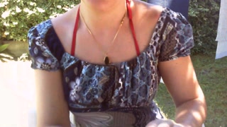 Nicoletta sunbathes in a public garden wearing a big dirty diaper