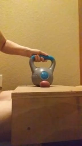 Wife crushes balls with kettle bells