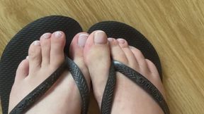 Toe tease in flip flops up close