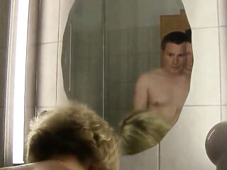 Older German golden-haired with short hair is taking a shower whilst her partner is getting lewd