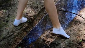 Dirty ankle socks, white socks in mud, muddy socks, muddy feet, girl in white socks walking in mud