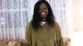 Randy black beauty strips down and exposes her luscious body on the sofa.
