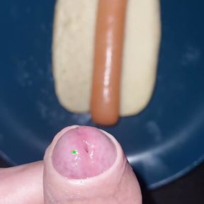 Huge watery cumshot on hotdog