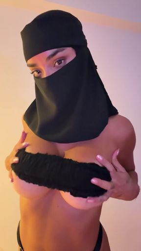 Professional black babe with big tits poses in solo sexy shoot