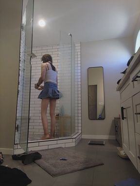 In the bathroom trying on different outfits getting wet and smoking