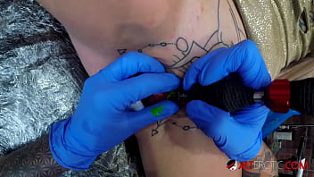 A sexy tattooed lady gets a wild clit tattoo, and it's too hot to handle!