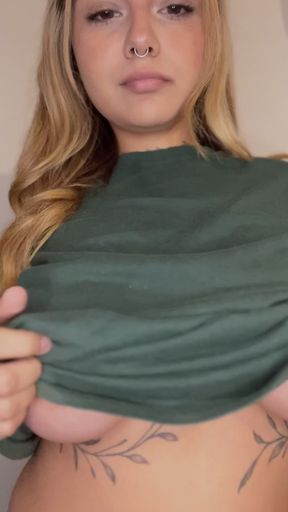 Busty blonde in green shirt