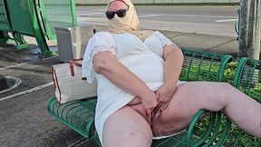 Mature hijab Milf masturbating with big dildo publicly outdoor at bus stop with cars passing by