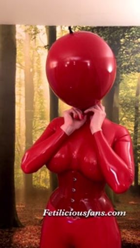 Miss Fetilicious putting on red 0.8 mm ball hood before shoot
