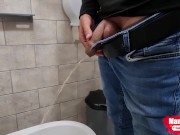 The guy takes a selfie as plentifully long pissing in the toilet