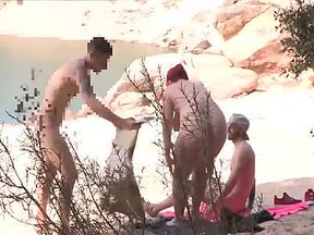 Couple Trio In A Nudist Beach