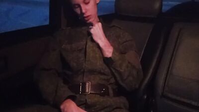 young military man jerks off his big cock in the car