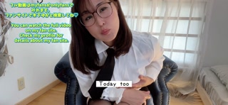 A girl with glasses wears high heels and girder stockings in an office lady's outfit and masturbates