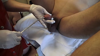 Dr. Amrita and Nurse Alyia test two of their slaves with n and urethral dilation.