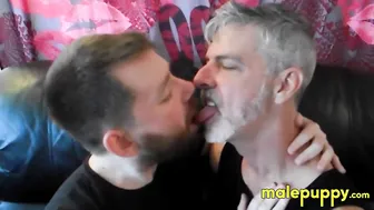 Gay bear cub Kaleb DeWulf kisses daddy Richard Lennox on the sofa