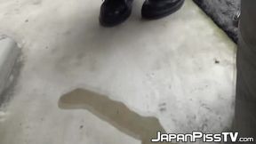 Young Asian redhead pees on the street