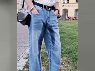 Public wetting in the centre of the city! T-girl walking with soaked jeans!