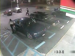 Hopeless ebony woman soaks the parking lot next to the car