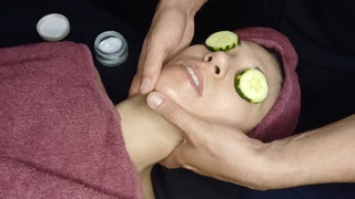 gentle facial massage with semen cream on the face