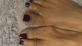 Melove in her Black Nail Polish wearing Jewelry on her long toes