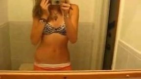Slender pretty blonde girl flashed her small tits while stripping on webcam