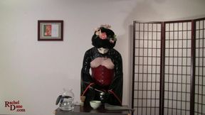 The latex concubine performs the Japanese Tea Ceremony