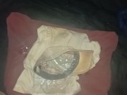 Pissing all over clothes before putting back on
