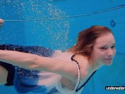 Teen girl Avenna is swimming in the pool