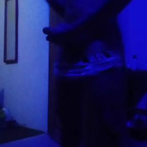 Black muscled guy masturbates in a blue room.