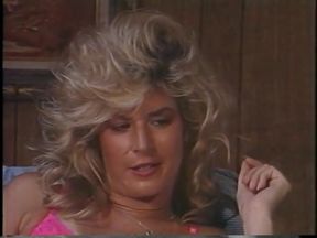 Classic stud sucks tranny cock while blond shoves dildo in his ass