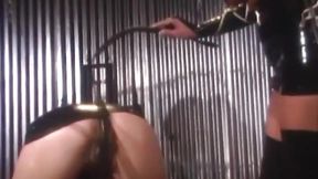 Blonde femme fatale in latex suit spanks and toys herself