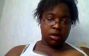 Ebony shows big tits on webcam