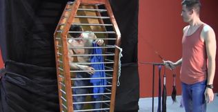 Caged boy is being whipped and seduced through BDSM