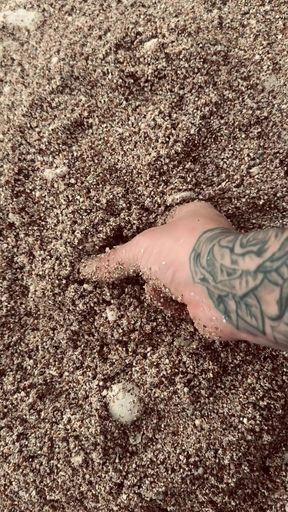 British Dannyroyal Playing around with the sand on the beach