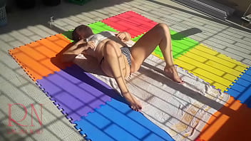 An attractive lady is sunbathing on the roof of her house. Nude yoga TEASER 1