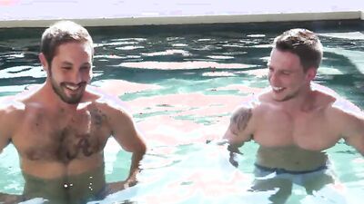 Buff jocks fool around in an outdoor pool before fucking hard