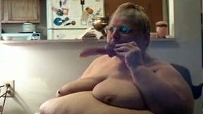 Ugly and morbidly obese webcam granny sucks dildo