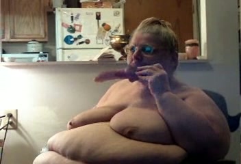 Ugly and morbidly obese webcam granny sucks dildo