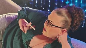 On my side in a new green blouse smoking a VS 120 closer up