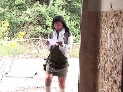 Brunette takes two cocks in an abandoned building