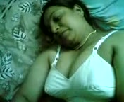 Fat nasty Indian whore lies on her back demonstrating me her huge tits and beaver