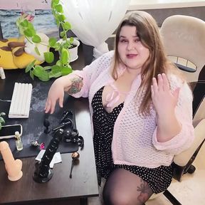 Russian Sex Shop Chubby Assistant Shows a Collection of Dildos and Anal Plugs