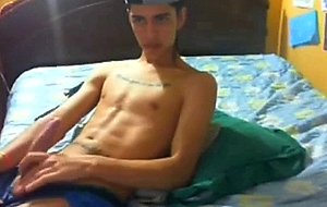 Latino twink strokes his dick
