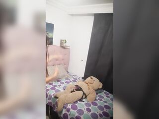 The tender hotty puts the harness on her teddy bear and rides him in her room