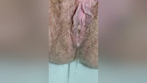 Detailed Close-up Footage Of A Hairy Pussy Girl Urinating From Her Pee Hole And Farting Loudly