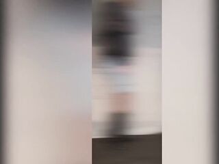 Crossdresser posing in hawt pants, boots, fishnet and corset, hawt red nails