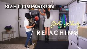 Size Comparison Stella Liberty Reaching Top Shelf for Tiny Man - Tyny needs help reaching a tall cabinet and calls a service that sends tall people to help - HD MP4