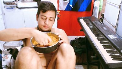 M a x x eats from a dog bowl in a dog collar